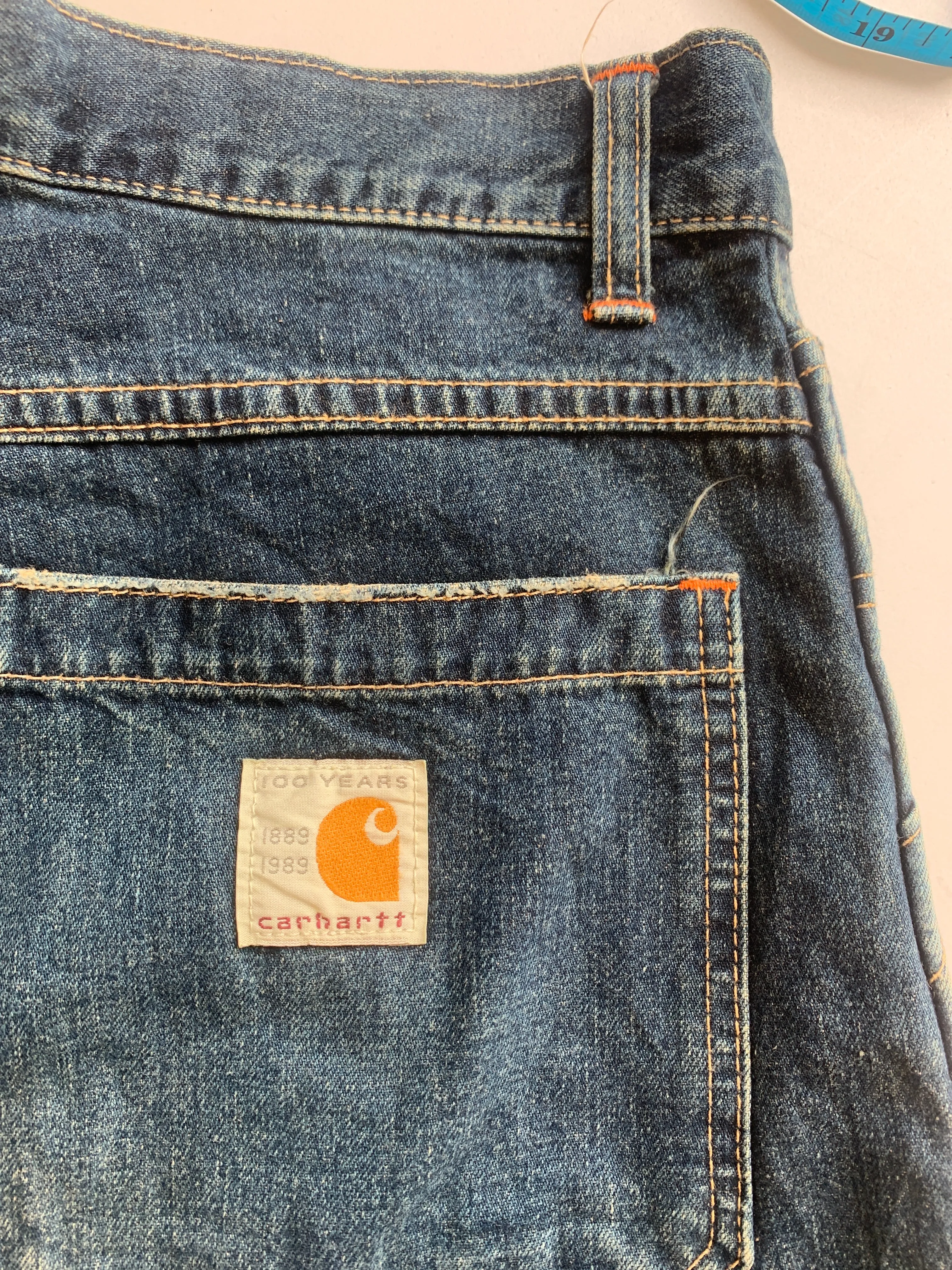 Carhartt dark wash denim cargo jeans